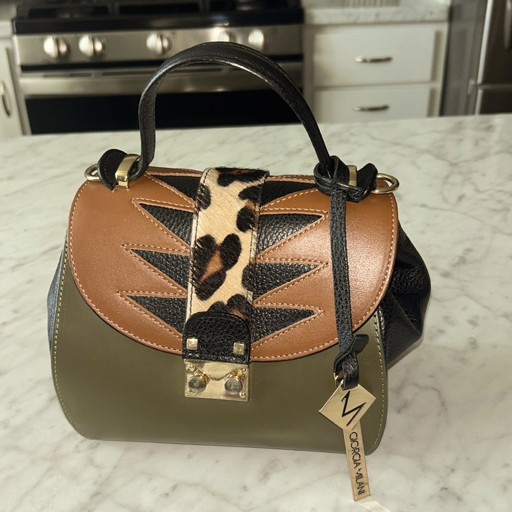 Beautiful leather crossbody handbag with dust cover and detachable strap